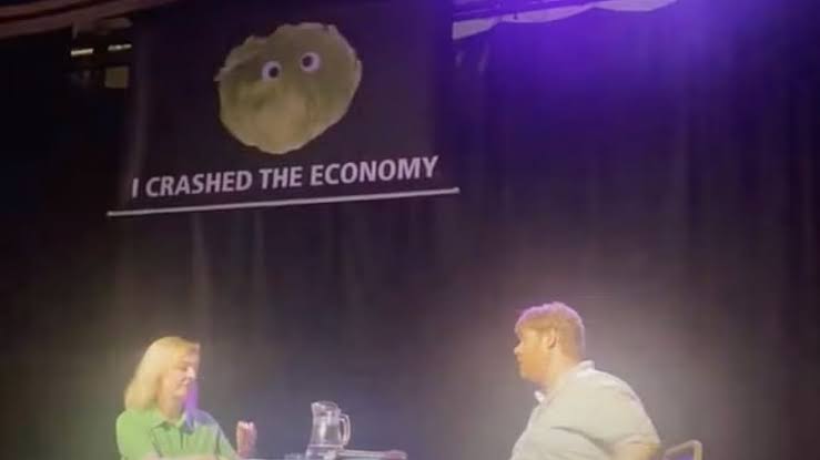Liz Truss storming out of a conference that was sabotaged by some groups and a lettuce.